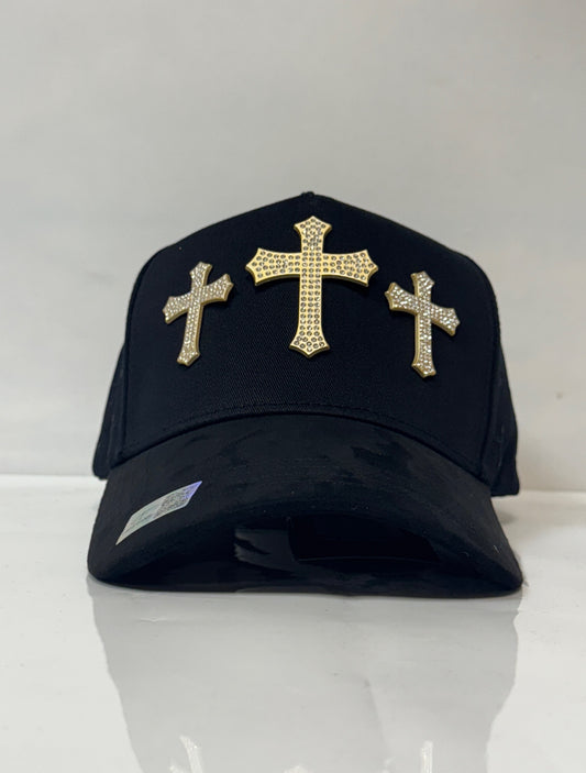Gold cross caps./ Gorras de cruces doradas